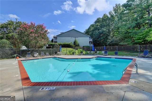 view of pool featuring a patio area