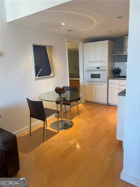 dining area with light wood-type flooring