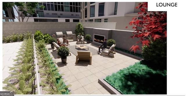 view of patio with an outdoor fireplace and exterior kitchen