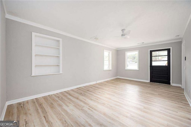 entryway with light hardwood / wood-style floors, ceiling fan, and crown molding