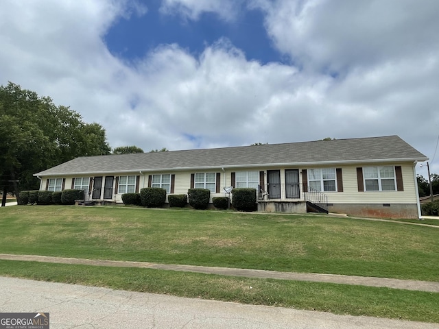 single story home with a front lawn