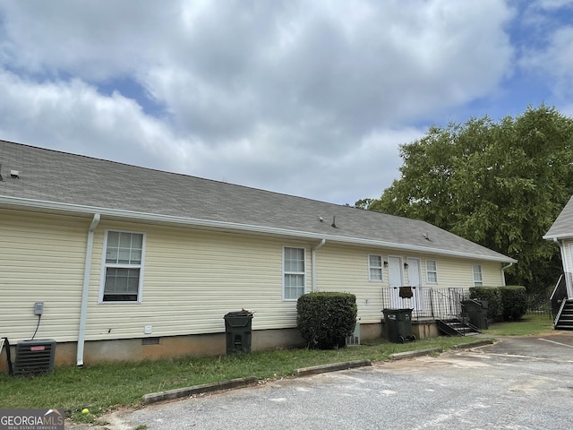 rear view of house with central AC