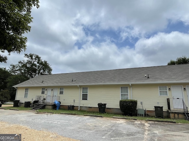 back of property with central AC unit