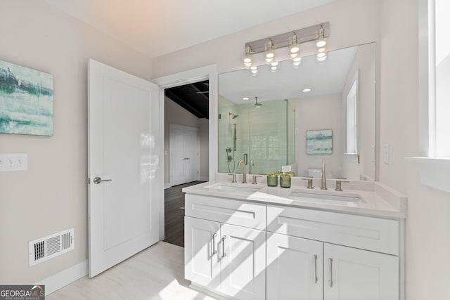 bathroom with vanity and walk in shower