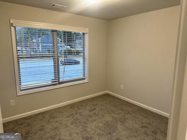 empty room featuring carpet floors