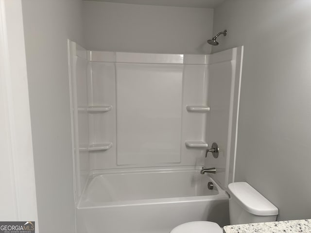 bathroom with shower / tub combination and toilet