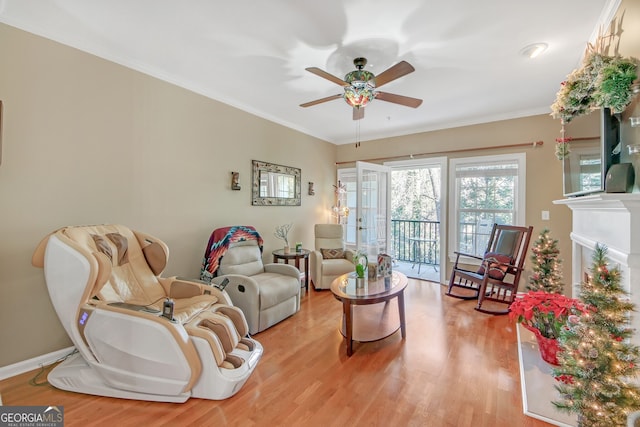 kitchen featuring white cabinets, stainless steel appliances, light hardwood / wood-style flooring, and ornamental molding