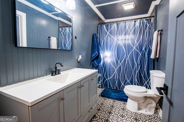 bathroom featuring vanity, toilet, and crown molding