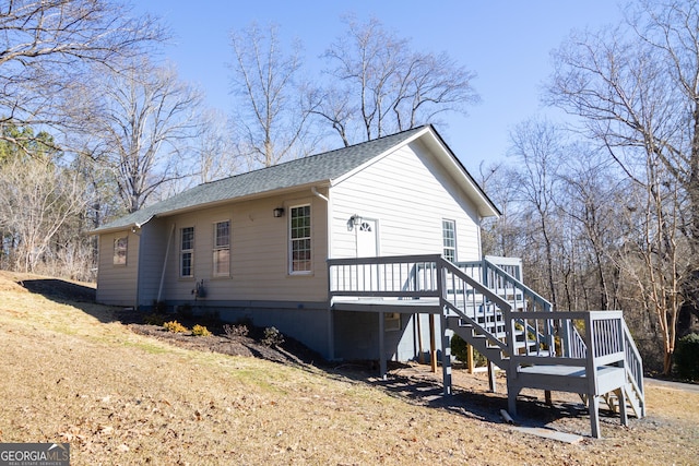 view of side of property with a deck