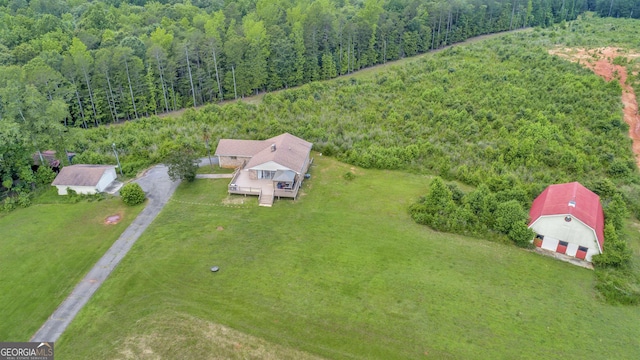 bird's eye view featuring a forest view