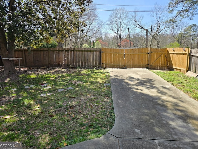 view of yard featuring a gate and fence