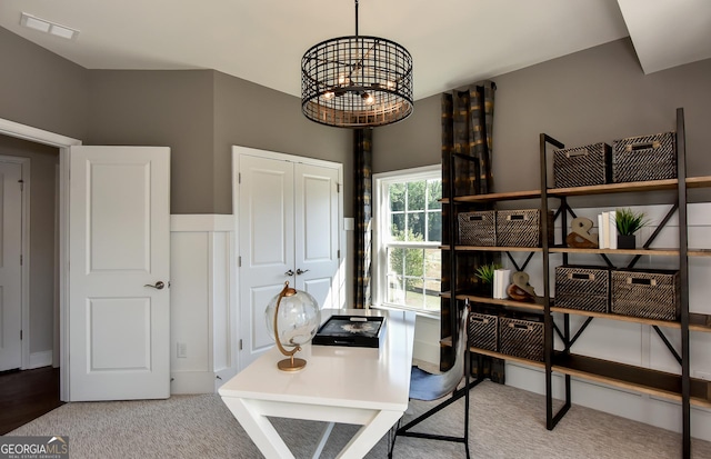 office area featuring an inviting chandelier