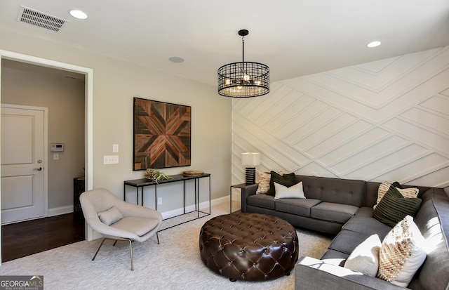 living room featuring a notable chandelier