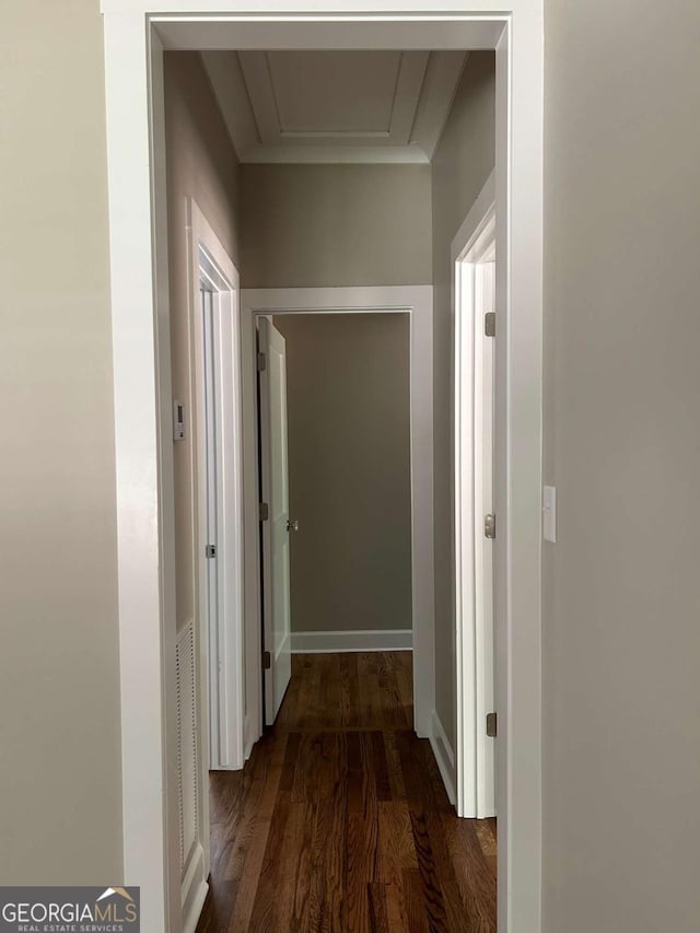 corridor with dark hardwood / wood-style flooring