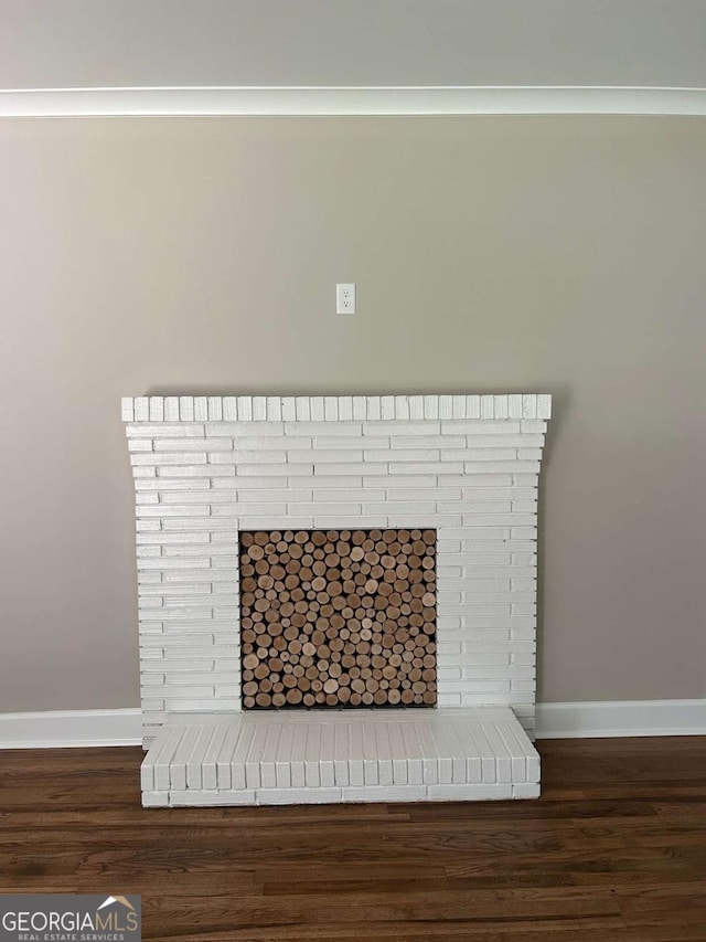 interior details featuring a fireplace and hardwood / wood-style floors