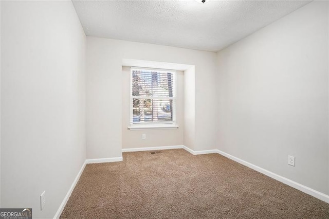 spare room with carpet floors