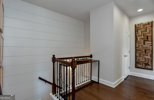 stairs with wood-type flooring