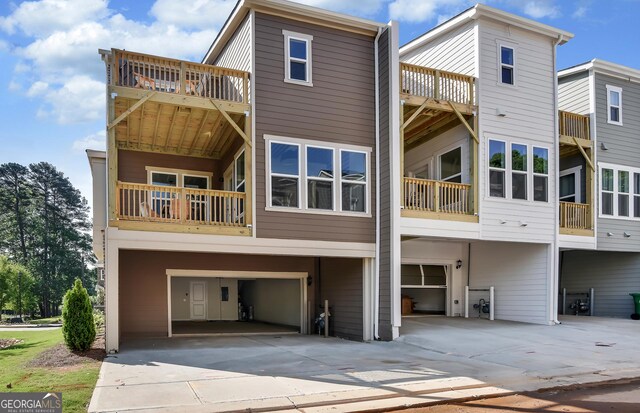 rear view of house featuring a garage