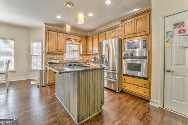 kitchen featuring hanging light fixtures, dark hardwood / wood-style floors, decorative backsplash, a kitchen island, and stainless steel appliances