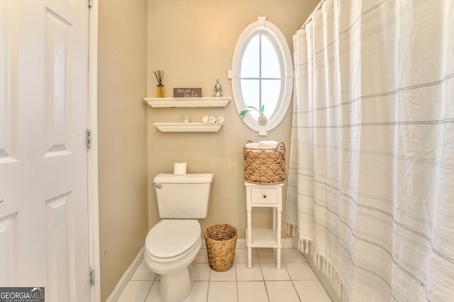 bathroom with tile patterned floors and toilet