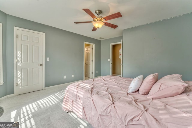 carpeted bedroom with ceiling fan