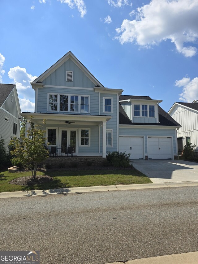 view of front facade with french doors and a garage