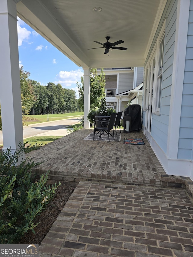 view of patio featuring a ceiling fan and covered porch