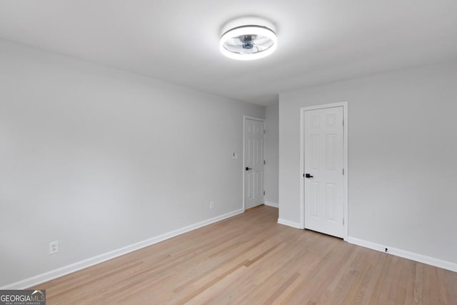 spare room featuring light hardwood / wood-style flooring