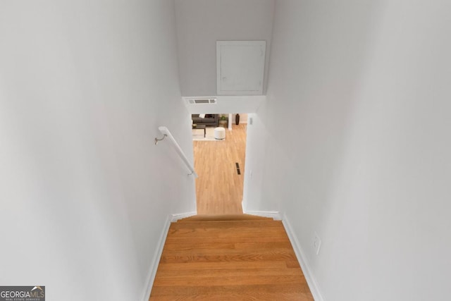 stairway with wood-type flooring