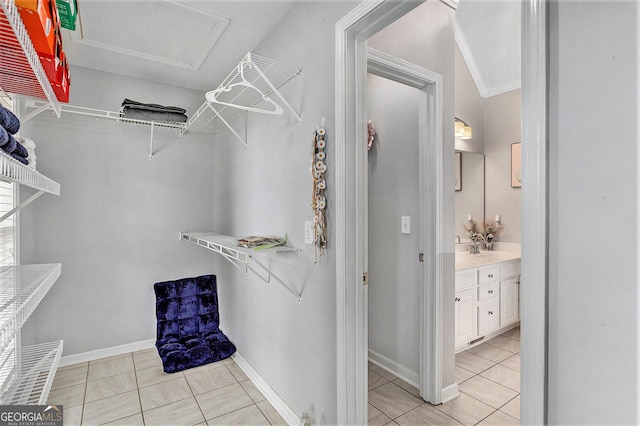 walk in closet featuring light tile patterned flooring