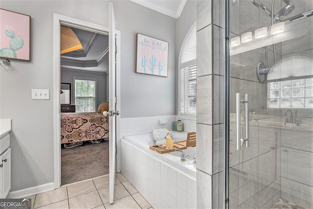 bathroom featuring plus walk in shower, vanity, tile patterned floors, and ornamental molding