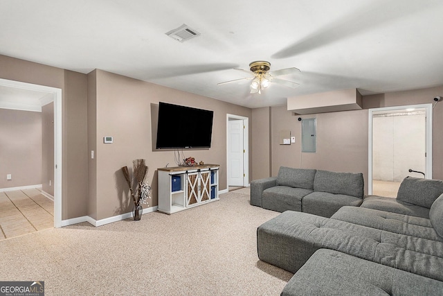 carpeted living room featuring electric panel and ceiling fan