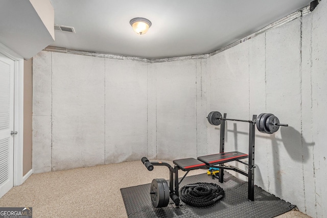 exercise room featuring carpet