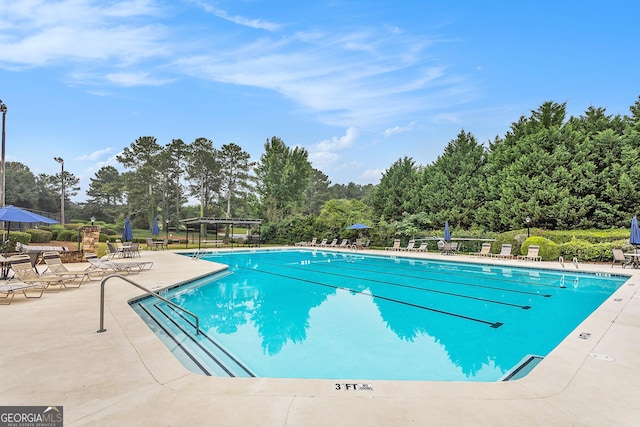 view of swimming pool with a patio area