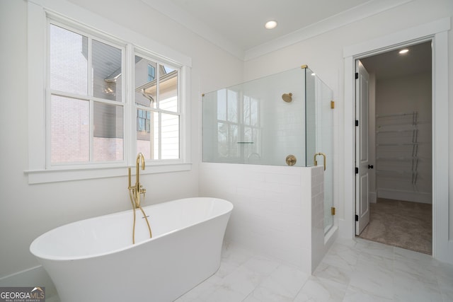 full bath featuring a stall shower, marble finish floor, crown molding, a freestanding bath, and recessed lighting