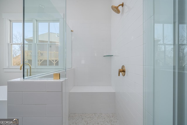 full bath featuring tiled shower