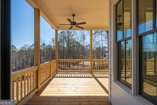 wooden deck with ceiling fan