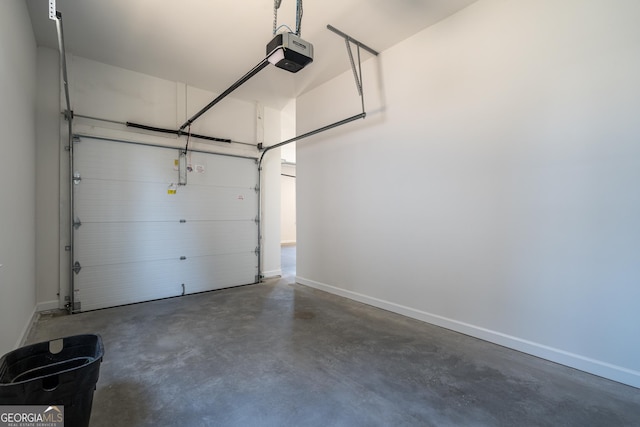 garage featuring baseboards and a garage door opener