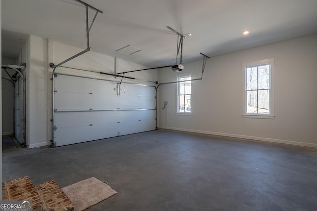 garage featuring baseboards and a garage door opener