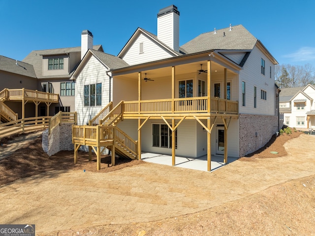 rear view of property with a patio, a shingled roof, a ceiling fan, stairs, and a wooden deck