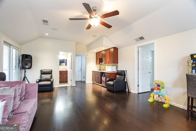 living room with dark hardwood / wood-style floors, vaulted ceiling, and ceiling fan