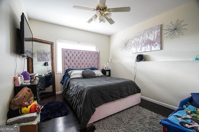 bedroom featuring ceiling fan and dark hardwood / wood-style floors