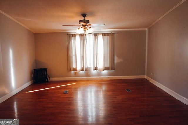 empty room with ceiling fan, ornamental molding, and hardwood / wood-style flooring