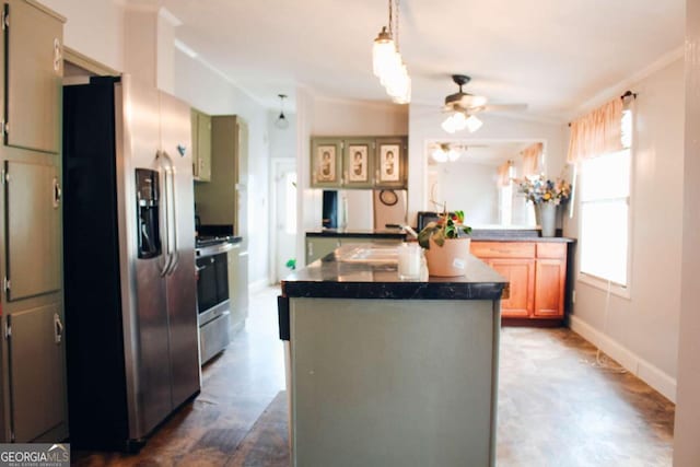 kitchen featuring stove, sink, stainless steel refrigerator with ice dispenser, ceiling fan, and kitchen peninsula