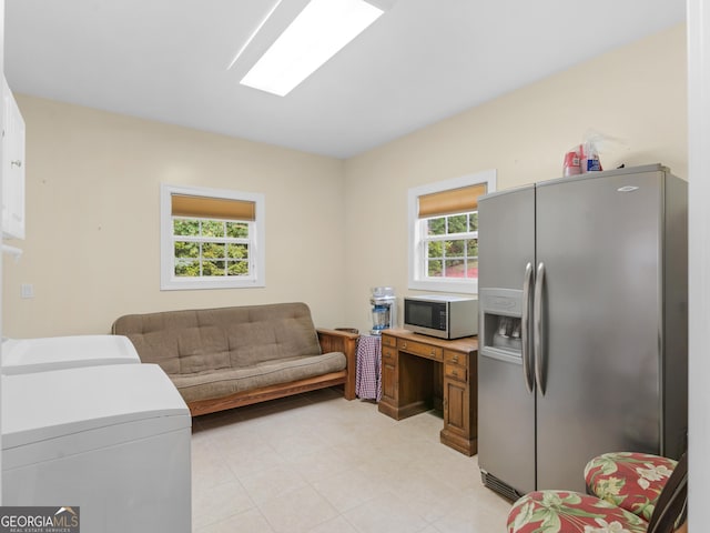 interior space featuring a healthy amount of sunlight and washing machine and clothes dryer