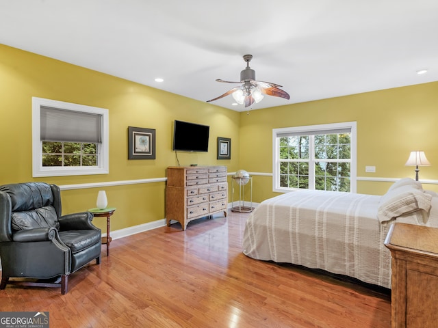 bedroom with ceiling fan and wood-type flooring