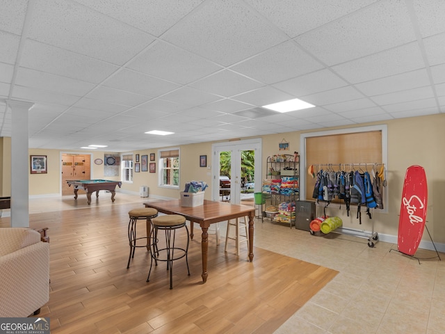 game room featuring a paneled ceiling, hardwood / wood-style flooring, billiards, and french doors