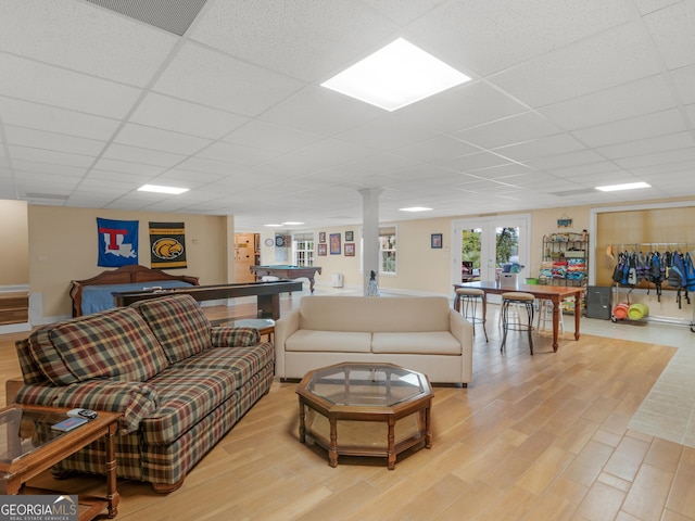 living room with french doors, a paneled ceiling, light hardwood / wood-style floors, and billiards