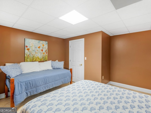 bedroom featuring a drop ceiling