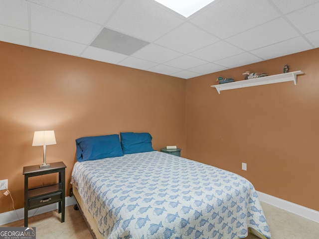 bedroom with a paneled ceiling